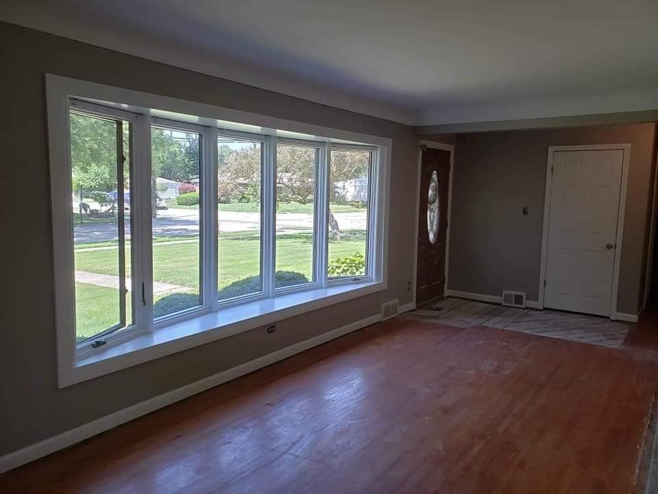 A&M Dearborn living room with neutral painted walls and white trim