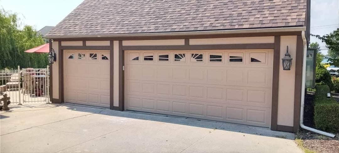 A&M Gibraltar garage with painted doors and contrasting exterior trim