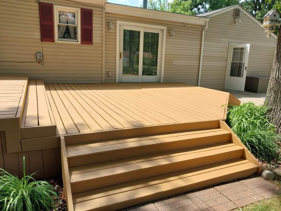 A&M Riverview refinished deck with wide steps and a tan finish